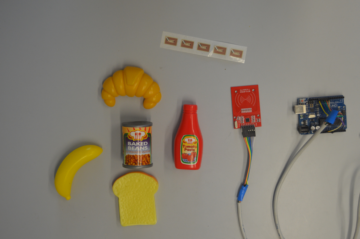 Initial prototyping with RFIDs, arduinos and plastic food toys.